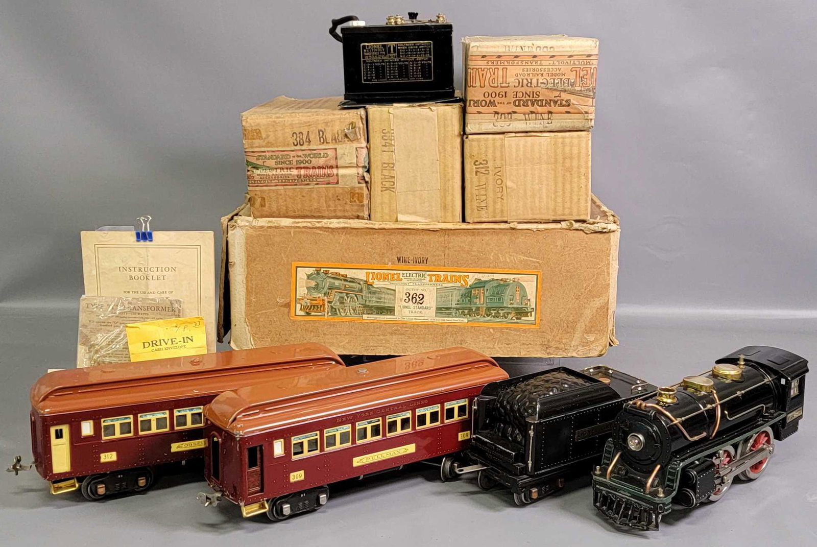 Boxed Lionel prewar standard gauge Outfit No. 362 with: Boxed Lionel Standard Gauge Outfit No. 362 with 384 and 384T steam locomotive and tender with 309 Pullman that has wood grained lithographed doors and 312 observation with yellow doors. Trains are C6-