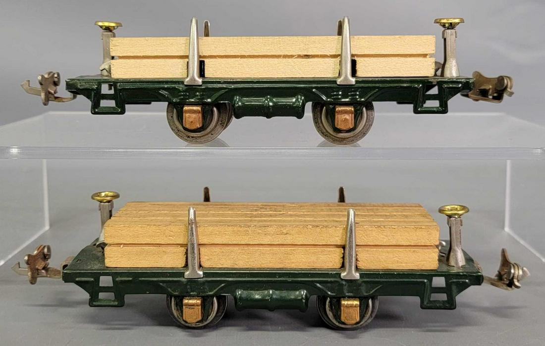 Two Lionel prewar O dark green 831 lumber cars: Two Lionel prewar O dark green 831 lumber cars, one with an original load, one with a reproduction load, C7.