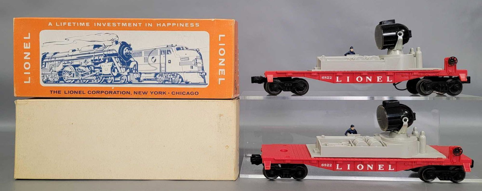 Two unrun Lionel postwar O 6822 night crew searchlight: Two unrun Lionel postwar O 6822 night crew searchlight cars in original boxes. Trains are C9-10, 0ne car has only one operating coupler, the other has two. Includes one picture box and one plain white