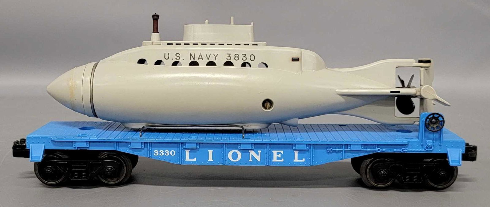 Lionel postwar O 3330 flat car with assembled 3830 US: Lionel postwar O 3330 flat car with assembled 3830 US Navy submarine. Car shows light run time and is C8with a C8 submarine.
