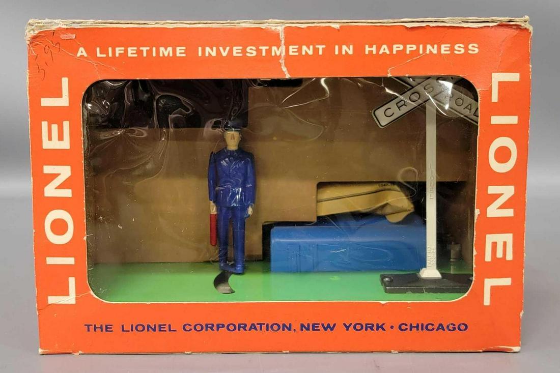 Mint Lionel postwar O 1047 switchman with flag in: Mint Lionel postwar O 1047 switchman with flag in original box. Accessory is C9-10 in a good original box with inner tape repairs and a sealed 1047-10 packet.