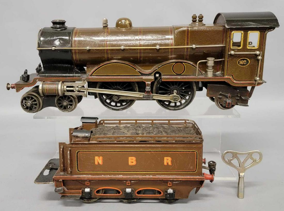 Marklin gauge I clockwork 102 NBR steam locomotive: Marklin gauge I clockwork 102 NBR steam locomotive and tender. The locomotive and tender are both exceptionally nice, all original and comes with an original key.
