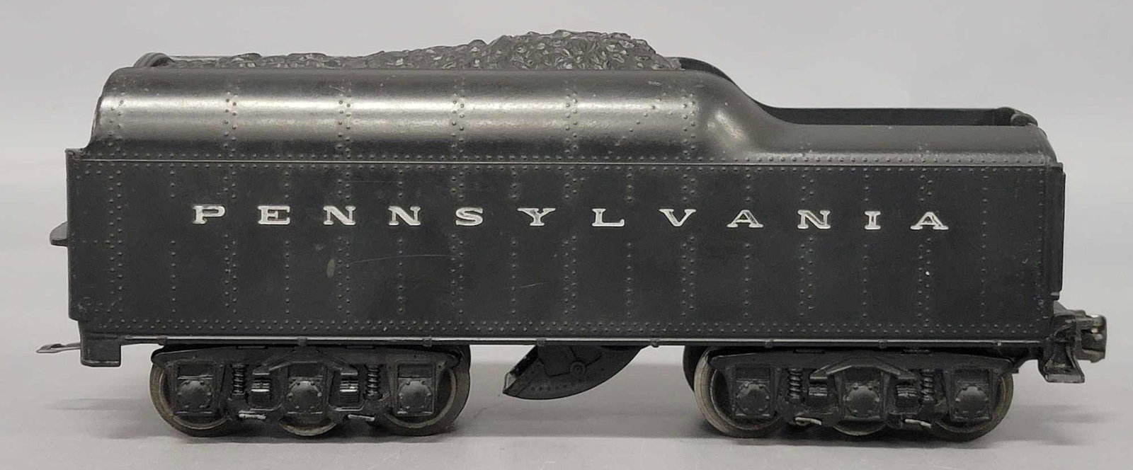 Lionel postwar O 2671W Pennsylvania tender w/ back up: Lionel postwar O 2671W Pennsylvania tender with back up lights, shows light to moderate run time and is C7.