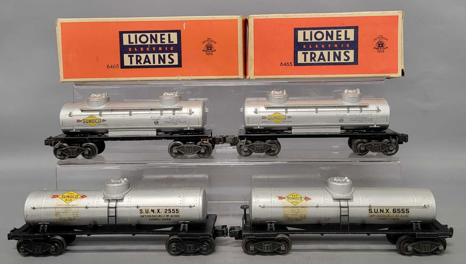 Four Lionel postwar O tank cars with two OBs (1 of 6)