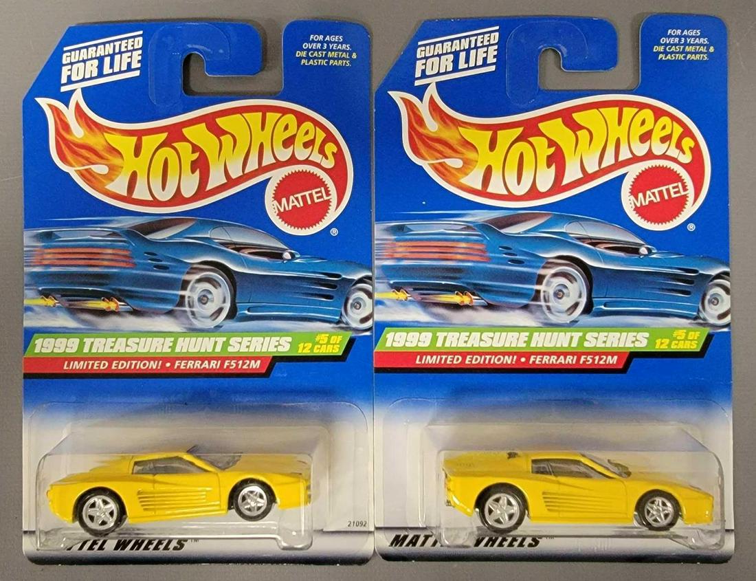 Group of two Hot Wheels 1999 Treasure Hunt Ferrari: Group of two Hot Wheels 1999 Treasure Hunt Ferrari F512M . Group includes one each of Black metal base and a regular metal base, both made in Malaysia. Cards are excellent but there is a 1" vein a