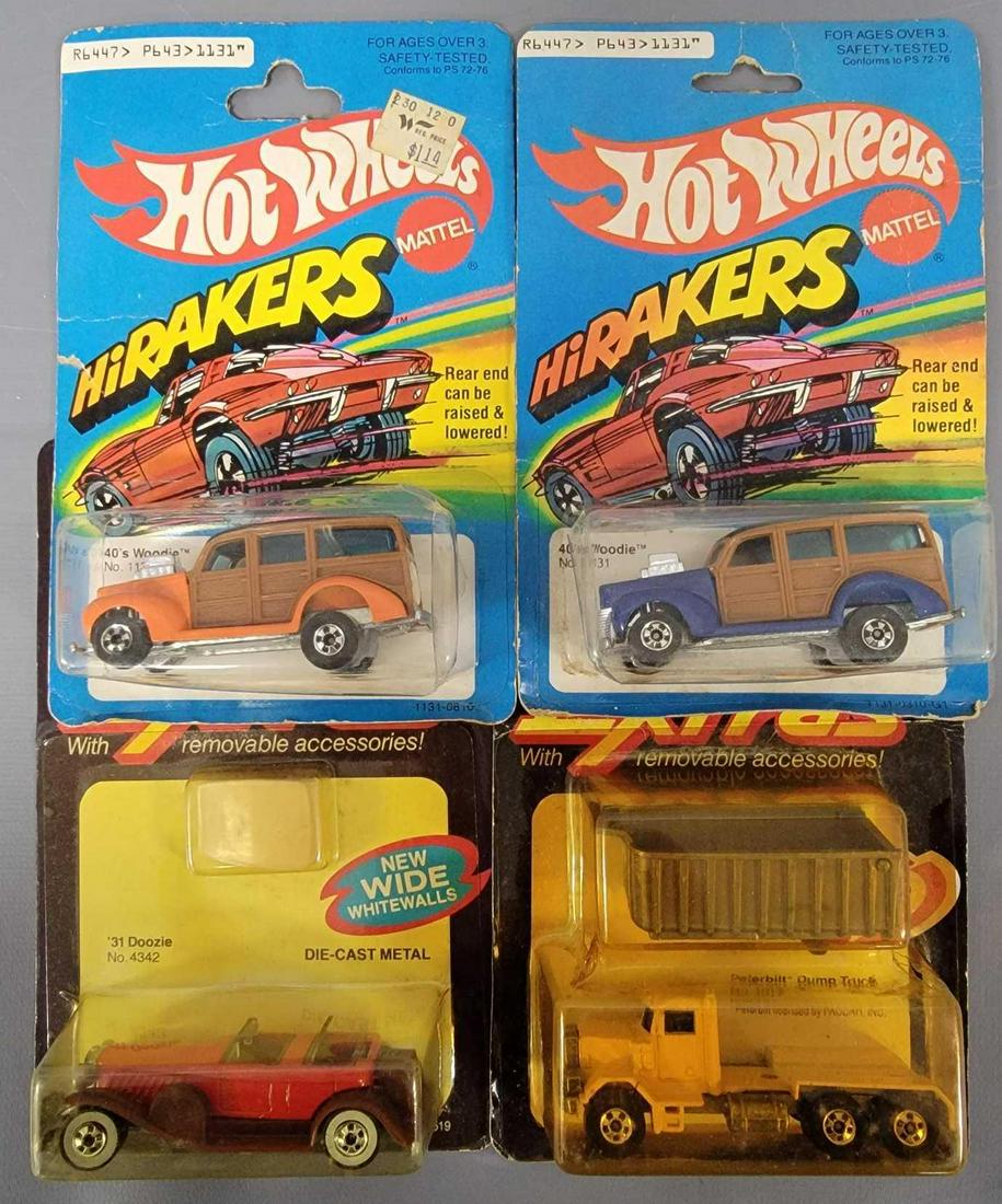 Group of four Hot Wheels Blackwalls Extras and Hi: Group of four Hot Wheels Extras and Hi Rakers. Group includes 2 Extras which are the Peterbilt Dump truck and the 31 Doozie, Hi Rakers include both a blue and an orange 40's Woodie. All cars are m