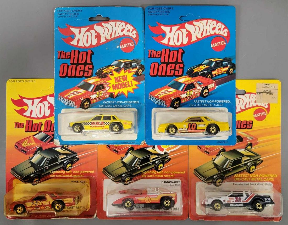 Group of five Hot Wheels Hot Ones Blackwalls on cards: Group of five Hot Wheels Hot Ones Blackwalls on cards. Group includes a Race Ace Stock car on a good card but blister is 2/3 off the card, a yellow Mirada Stocker, a yellow USA Taxi Service, a red Can