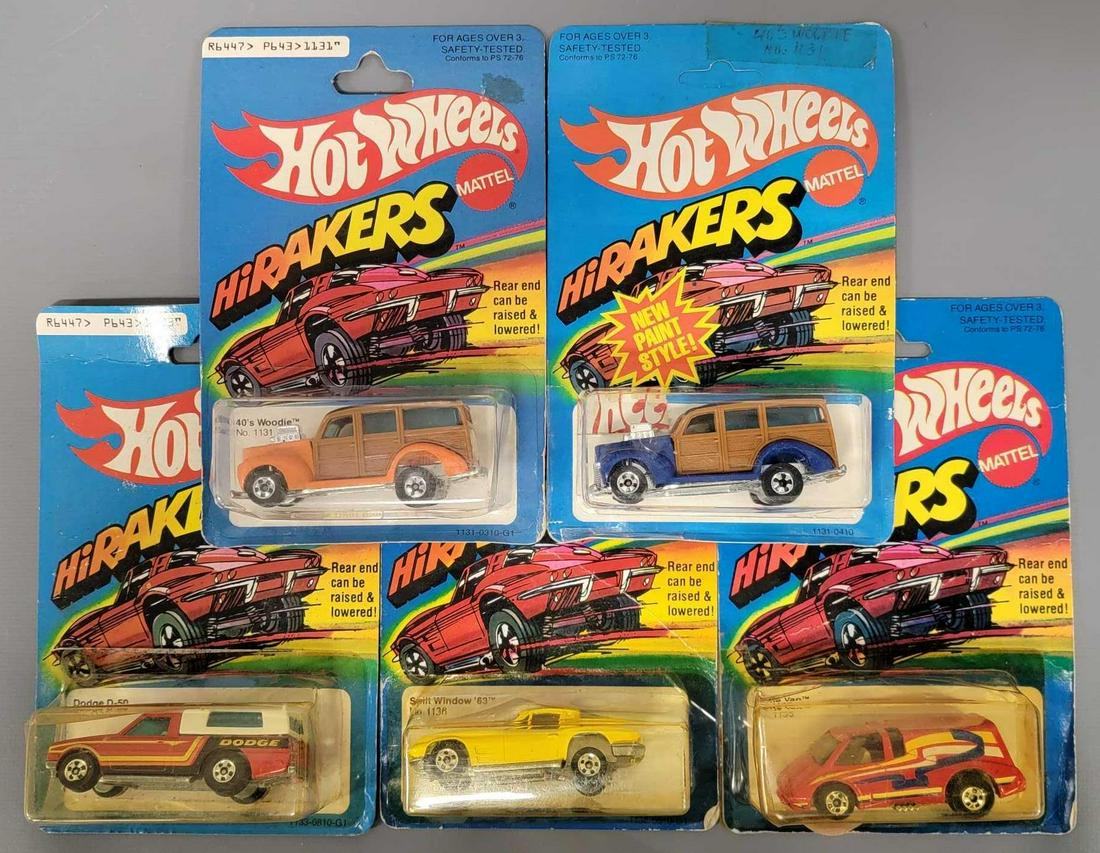 Group of five Hot Wheels Blackwall HiRakers on cards: Group of five Hot Wheels Blackwall HiRakers on cards. Group includes a Dodge D50 Pickup, a red Vette Van, an orange 40's Woodie, a blue 40's Woodie and a yellow Split Window '63. All cars
