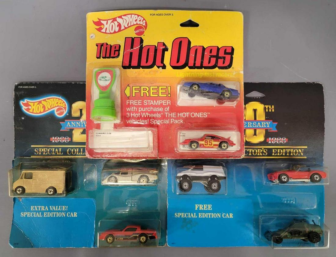 Group of three Hot Wheels three packs on cards: Group of three Hot Wheels three packs on cards. Group includes the Hot Ones stamper 3 pack with a blue firebird and a red Porsche, the camaro is missing. Also comes with a firebird stamper. 20th Anniv