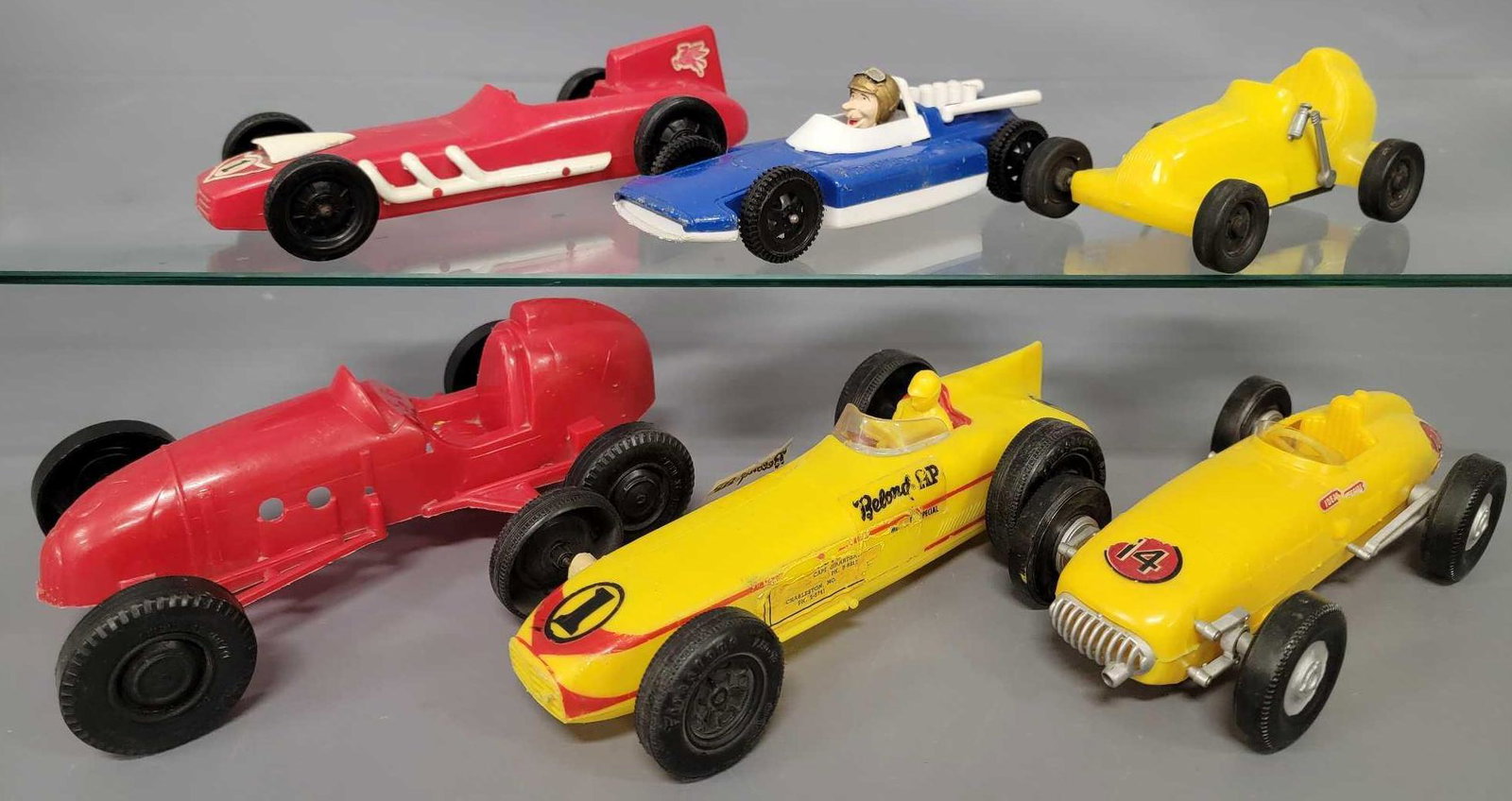 Six vintage plastic Indy cars: Six vintage plastic Indy cars to include one wind-up Marx, one Ideal, one Processed Plastic and three that are unmarked. These are in good to very good condition and measure between 6 and 9 1/2 inches