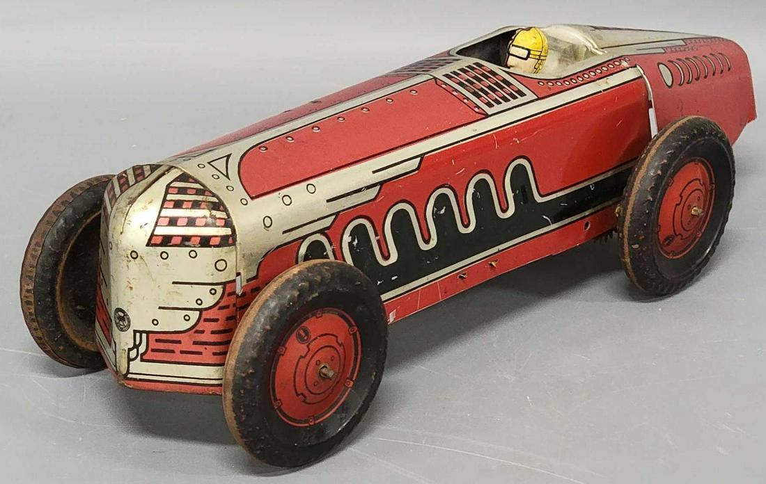 Vintage Marx tin lithographed racer: Vintage Marx tin lithographed racer, measures 13 inches long, missing all of the mechanical components that woukld have been inside for the clockwork operation. Sold as-is as seen in the photos with n