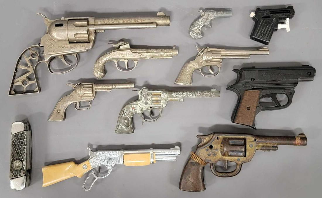 Large group of old smaller cap guns: Large group of old smaller cap guns to include a NicholsSpit-fire, Mattel Fanner 50 with missing grips, mattel Agent Zero M pistol in very played with condition and more. Sold as-is as seen in the pho