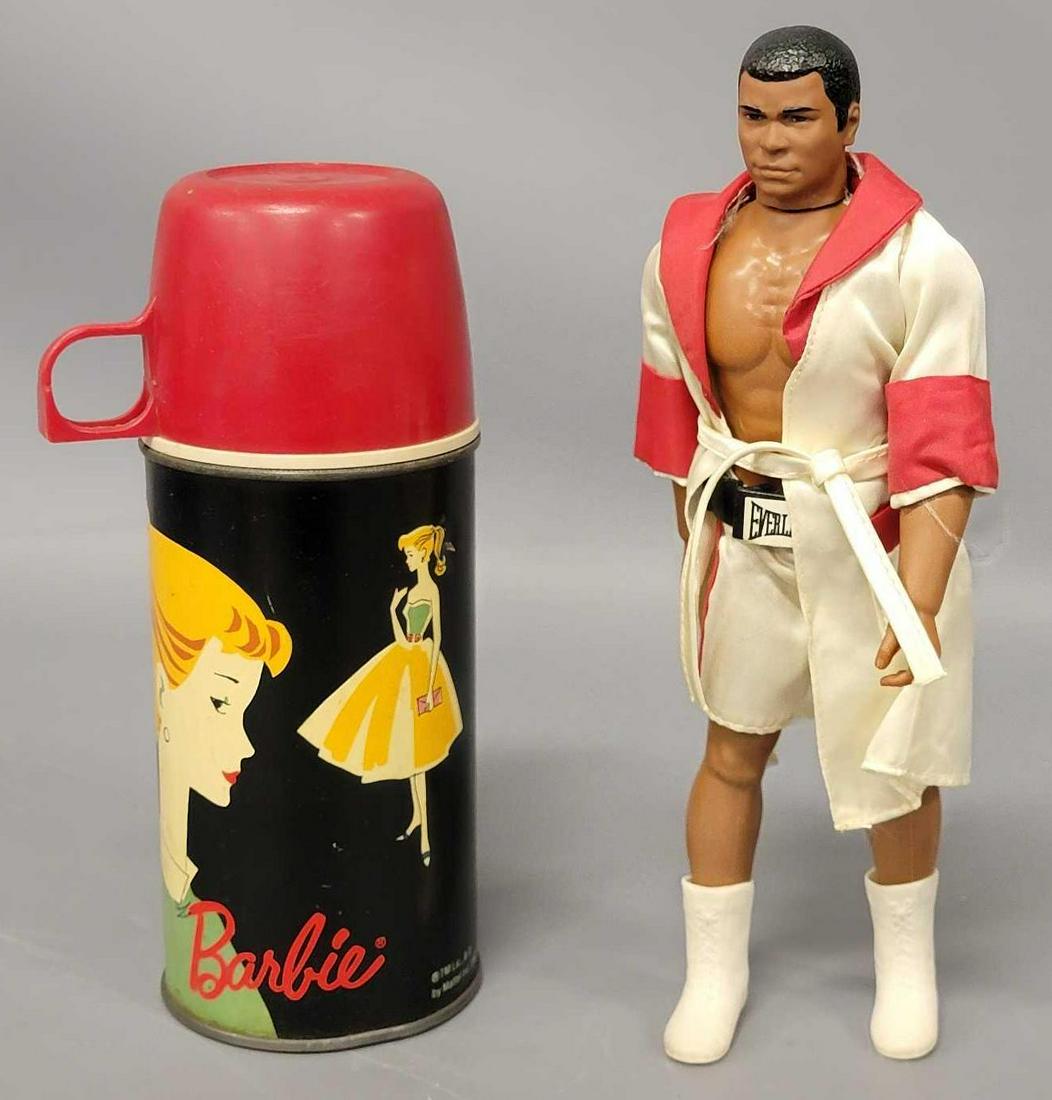 Mego Muhammad Ali and a Barbie thermos: Mego Muhammad Ali and a Barbie thermos, yeah, I know. Makes no sense but this is what was left for this guy. Don't be afraid to bid, the Ali figure is in excellent condition. The thermos is nice i