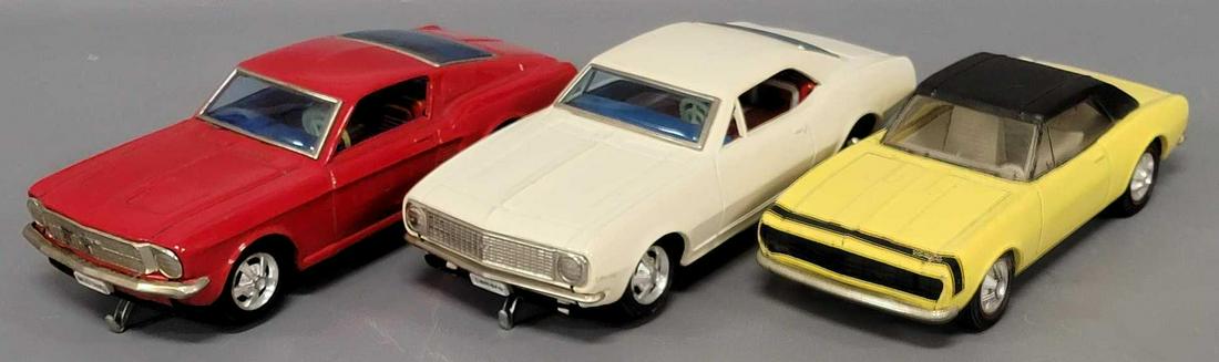 Three Japan tin lithograph bump n go cars (1 of 9)