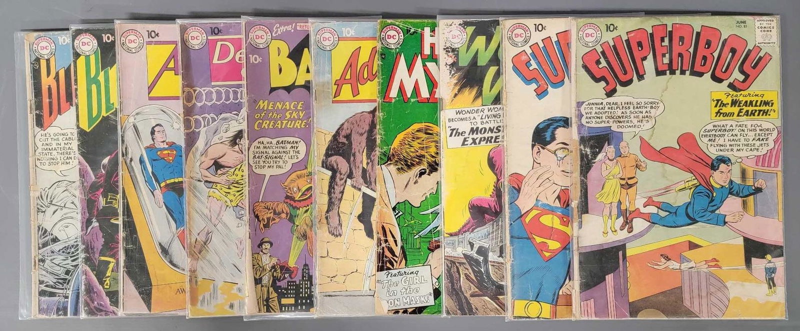 Ten worn 10 cent DC superhero comics (1 of 5)