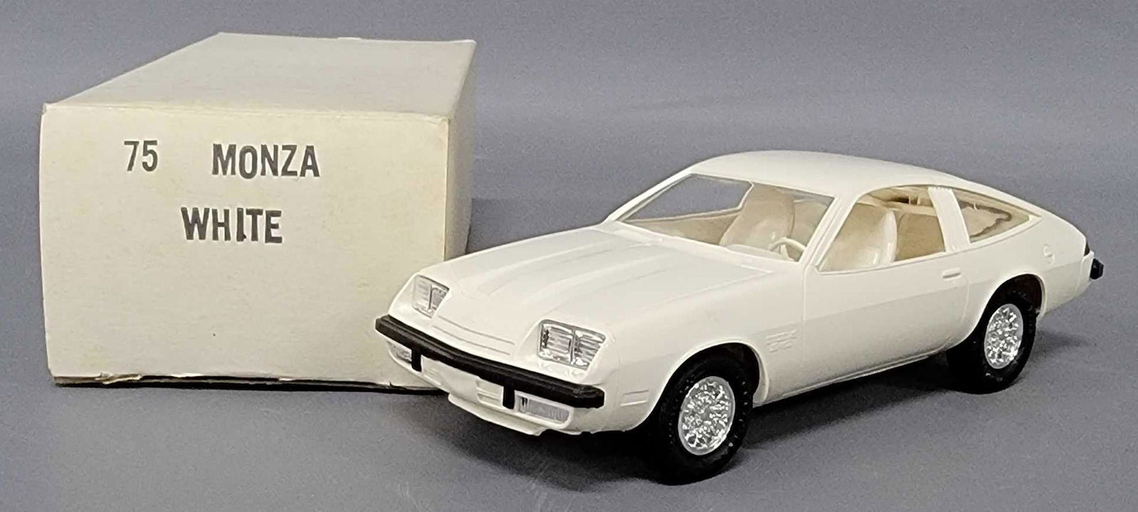 1975 white Chevy Monza dealer promo coaster car in original box: 1975 Chevy Monza dealer promo coaster car in white in original box, car is near mint to mint, box is very good with stamped end flap.