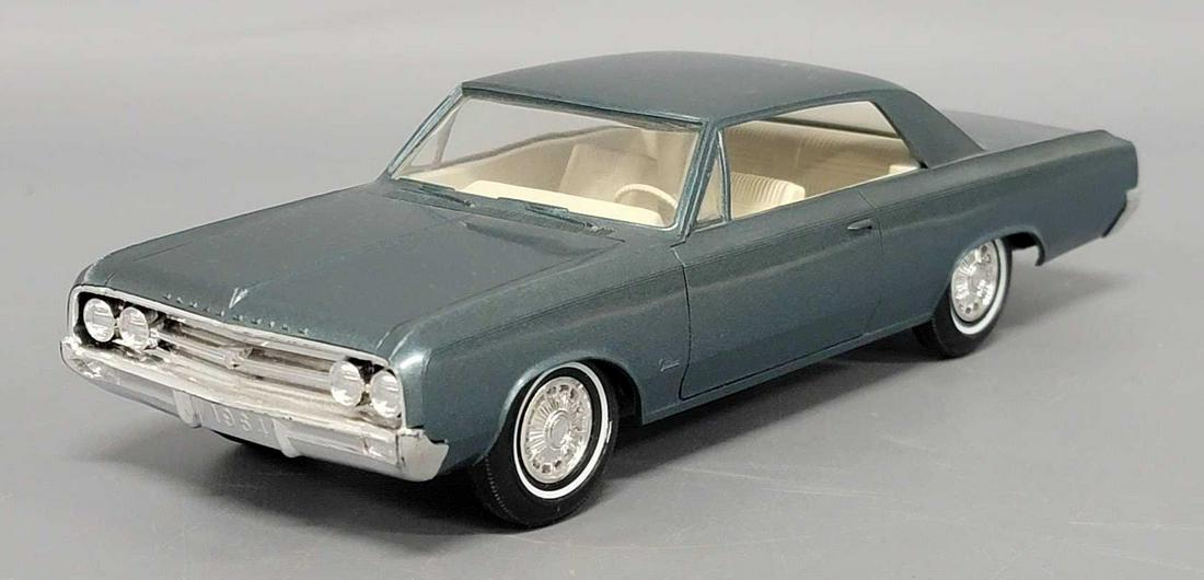1964 dark turquoise Oldsmobile Cutlass dealer promo coaster car (1 of 8)