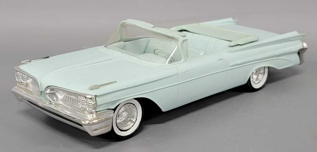 1959 light blue Pontiac Bonneville dealer promo coaster car: 1959 light blue Pontiac Bonneville dealer promo coaster car, car is near mint to mint, with no issues.