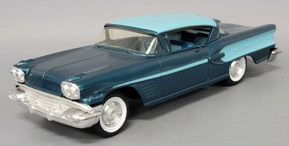 1958 two tone Pontiac Bonneville hardtop dealer promo coaster car: 1958 two tone blue Pontiac Bonneville hardtop dealer promo coaster car, car is excellent to near mint with very light warp.