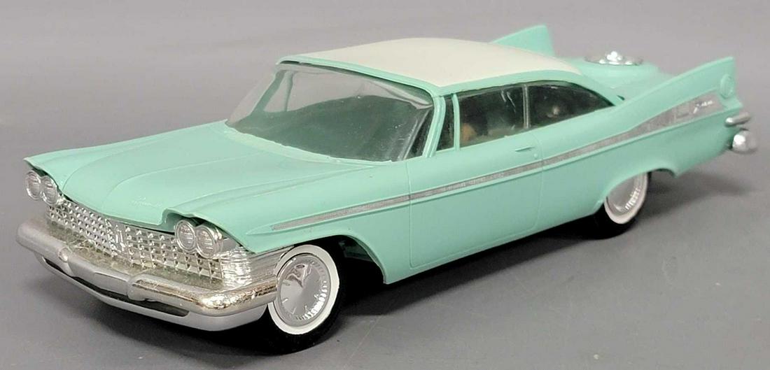 Jo-Han 1959 aqua Plymouth Fury dealer promo coaster car: Jo-Han 1959 aqua Plymouth Fury dealer promo coaster car, car is excellent, has front torsion bar suspension, it has some light scratches on the rear of the roof but otherwise no issues.