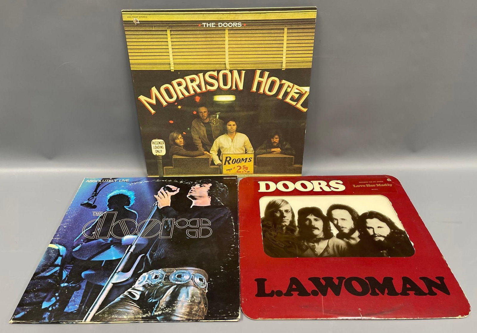 Three The Doors LPâ€™s: Three The Doors LPâ€™s, includes Morrison Hotel, L.A. Woman and The Doors Absolutely Live. Albums are excellent with the exception of L.A. Woman which has some longish light surface scratches on 