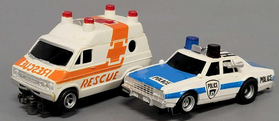 Two nice Aurora AFX slot cars: Two nice Aurora AFX slot cars, cars include a Chevy Caprice HY-71 Police cruiser and an orange and white Rescue Ambulance, both are excellent with no missing or broken parts. Neither of these ran when