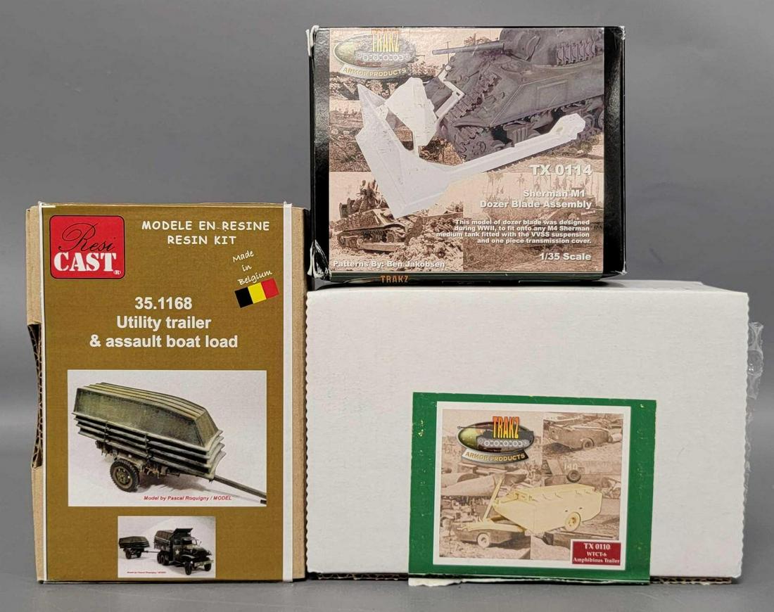 Three 1/35 scale Military model kits in original boxes: Three 1/35 scale Military model kits in original boxes, includes Trakz TX 0114 Sherman M1 Dozer Blade Assembly, Trakz TX 0110 WTCT-6 Amphibious Trailer and Resicast 35.1168 Utility Trailer & assau