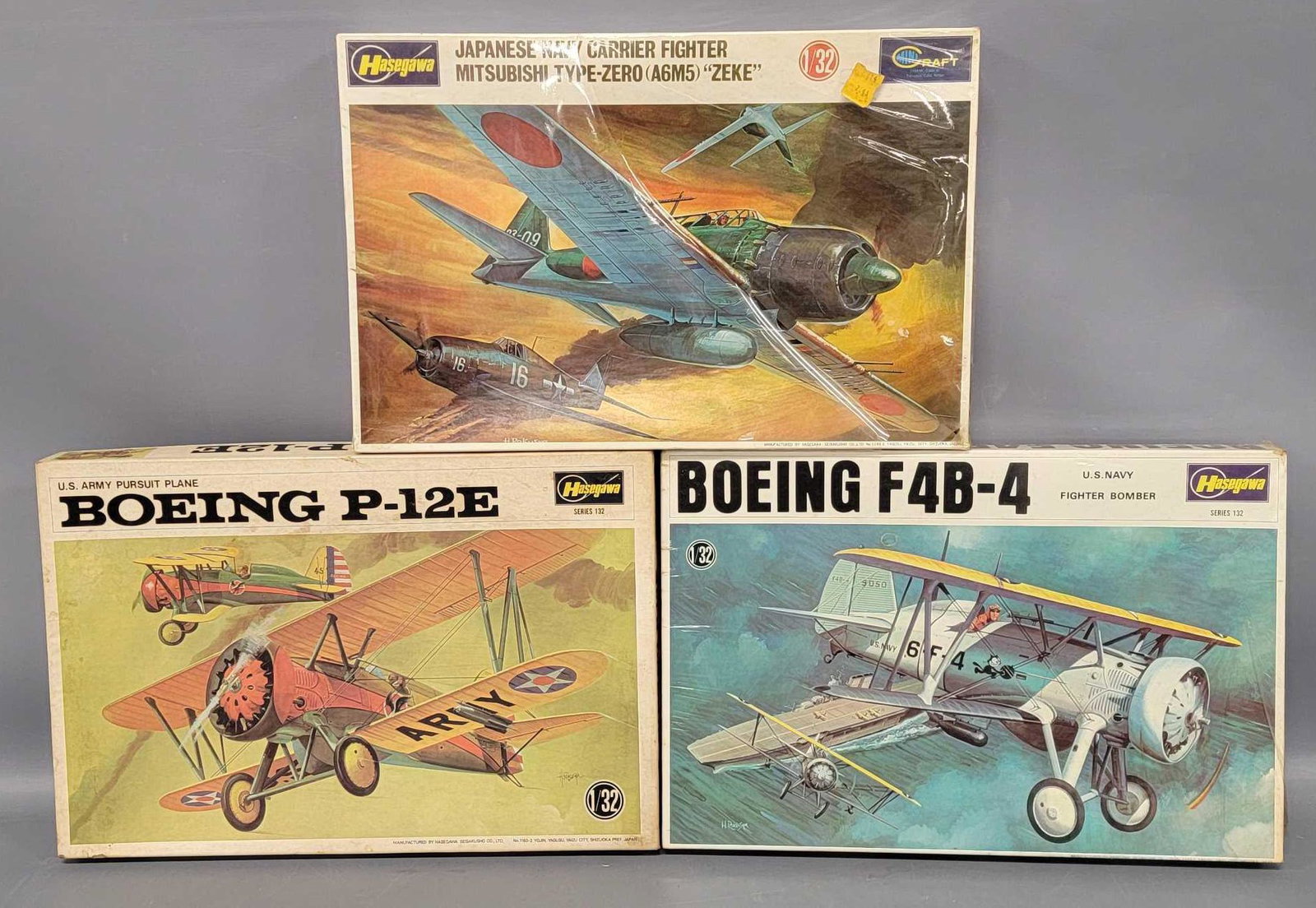 Three Hasegawa 1/32 scale plane model kits in original boxes: Three Hasegawa 1/32 scale plane model kits in original boxes, incudes JS-061-350 US Army Pursuit Plane Boeing P-12E, JS-066-400 Boeing F4B-4 and JS-070-450 Mitsubishi Type-Zero (A6M5) Zeke, the P-12E 