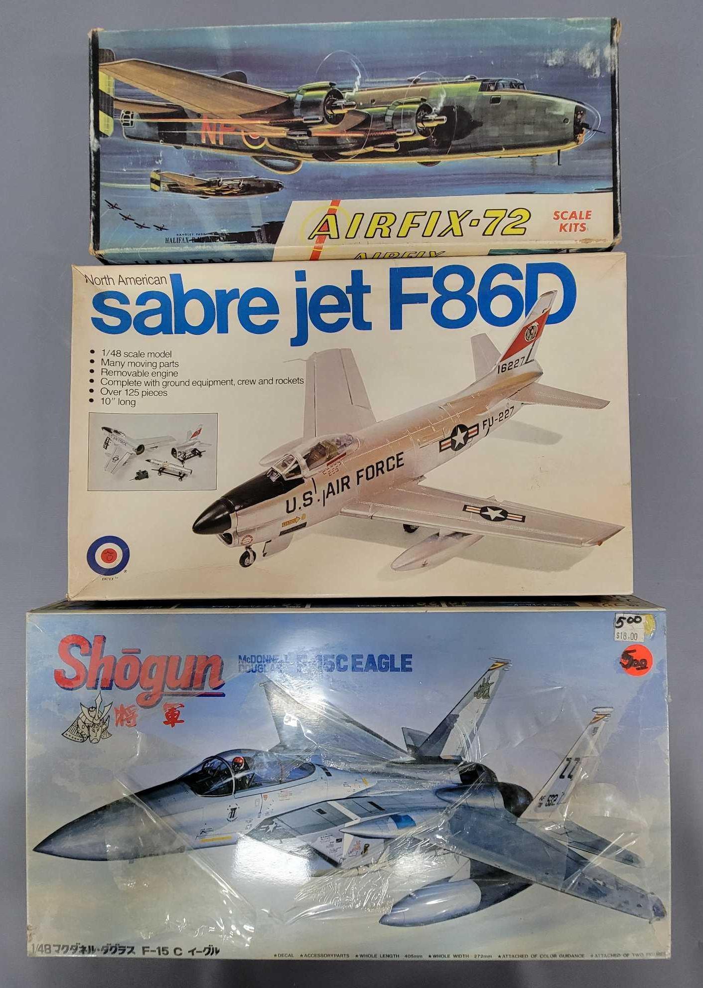 Three mixed scale and make military plane model kits in original boxes: Three mixed scale and make military plane model kits in original boxes, includes Airfix-72 1/48 scale 2-129 Halifax B.MK. III, Entex 9009 North American Sabre Jet F86D and Shogun 5A54 1/48 scale F-15C