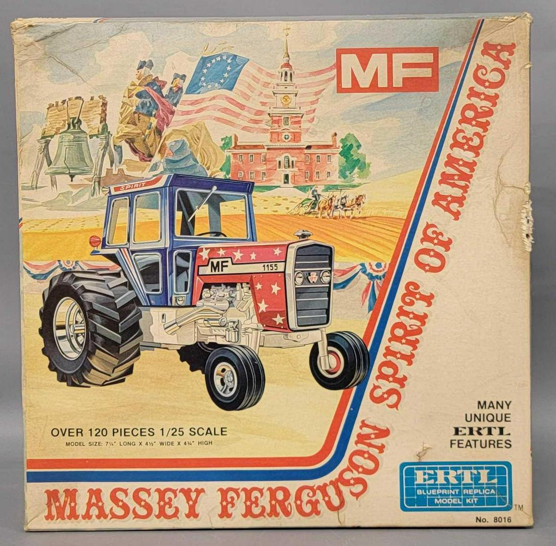 ERTL 8016 Massey Ferguson Spirit of America model tractor kit in original box: ERTL 8016 Massey Ferguson Spirit of America model tractor kit in original box, kit appears mostly complete as it is missing its rear tires at minimum, the main body was painted blue at some point but 