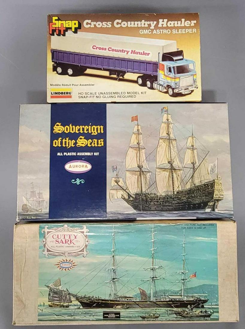 Three mix small scale model kits in original boxes: Three mix small scale model kits in original boxes, includes Lindberg Snap Fit Cross Country Hauler, Aurora Cutty Sark and Aurora Sovereign of the Seas, all appear complete with instructions and decal