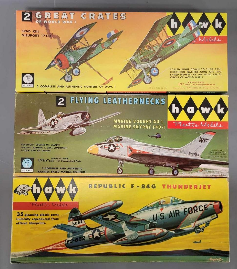 Three Hawk mixed scale plane model kits in original boxes: Three Hawk mixed scale plane model kits in original boxes, includes 1/48 scale 525 2 Great Crates of WWI, 1/72 scale 523 2 Flying Leathernecks and an unknown scale 505 Republic F-84G Thunderjet, all k
