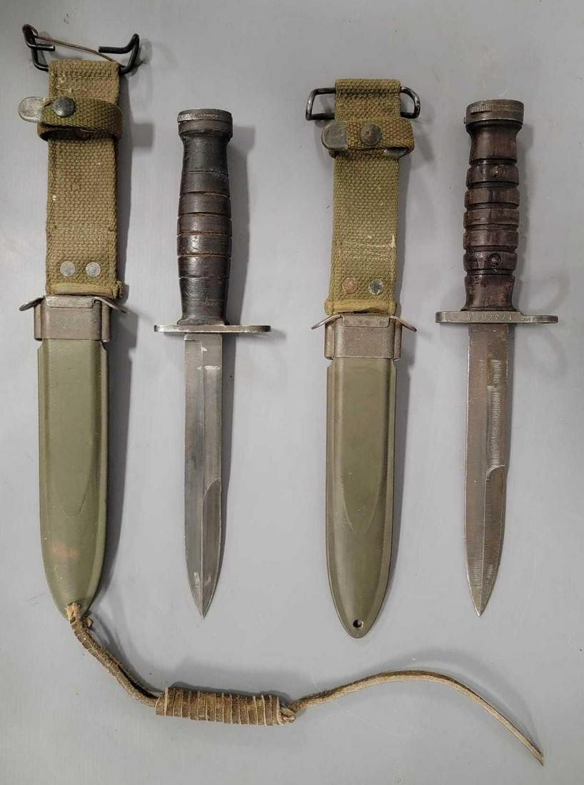 Two WWII era US M4 bayonets with scabbards: WWII era US M4 bayonets, first is in very good condition, tang appears to be leather wrapped, black blade, there is a P engraved on the butt, has a nice original sheath marked M8A1, second is in very 