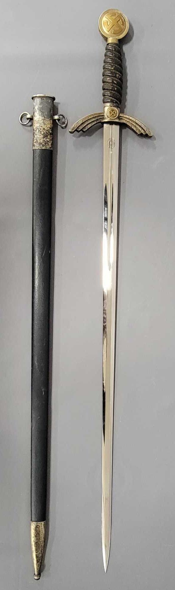 German World War II Luftwaffe Officers Sword with scabbard: German World War II Luftwaffe Officers Sword with scabbard, inscribed Paul Weyersberg & Co. Solingen with a Sword and Laurel leaf, blade is very clean with very few marks, hilt is leather wrapped,