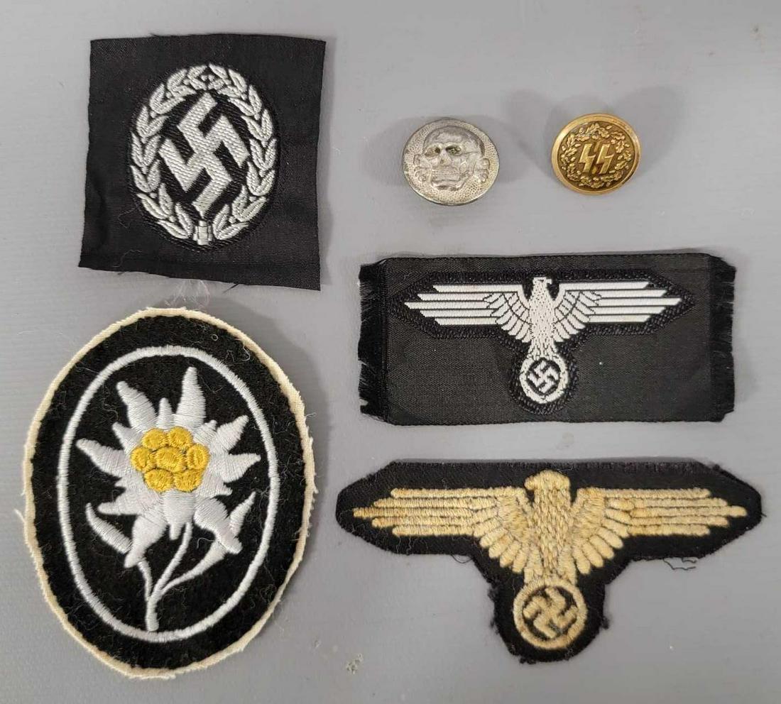 Four Nazi German SS World War II patches and two buttons: Four Nazi German SS World War II patches and two buttons, includes an SS insignia swatch, an Imperial Eagle swatch, an Imperial Eagle patch and an Edelweiss Hitlers guard patch, the two buttons are an