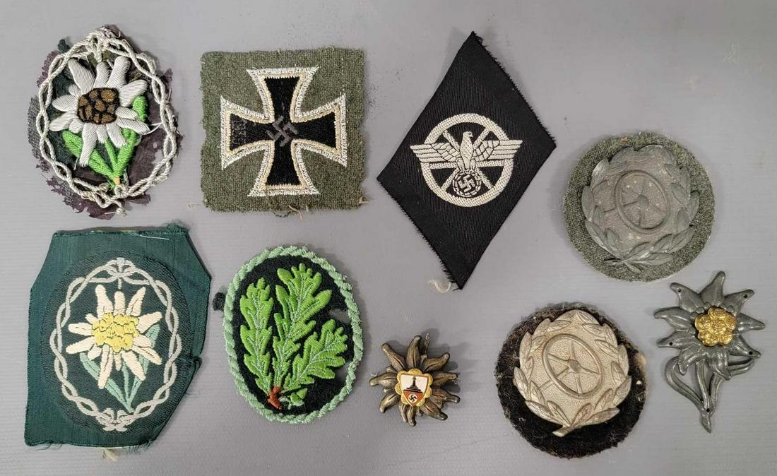 Five German World War II swatches and patches plus four metal badges: Five German World War II swatches and patches plus four metal badges, includes two Edelweiss patches one unknown plant patch, a 1939 Iron Cross patch and an Imperial Eagle swatch, also includes two me