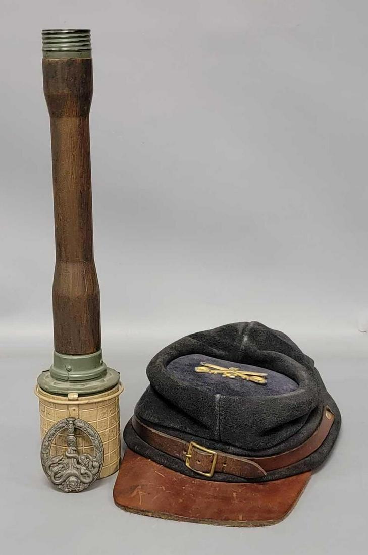 Group of three replica military pieces: Group of three replica military pieces, includes a replica suede Civil war hat, a replica German anti-partisan badge and a replica World War II German hand grenade.