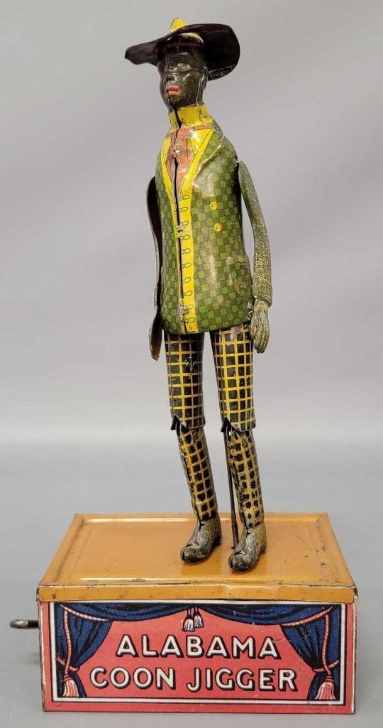 Ferdinand Strauss Tombo the Alabama Coon Jigger windup toy: Ferdinand Strauss Tombo the Alabama Coon Jigger windup toy in working condition. Clean toy with a little bending to hat brim. The arms are reproductions, the rest of it is all original.