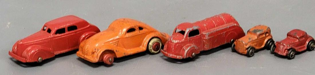 Five assorted vintage cast metal cars: Five assorted vintage cast metal cars, includes Lineol cast metal orange coupe in good condition but is missing the rubber on one front tire, two tootsie toys including a red sedan in excellent condit