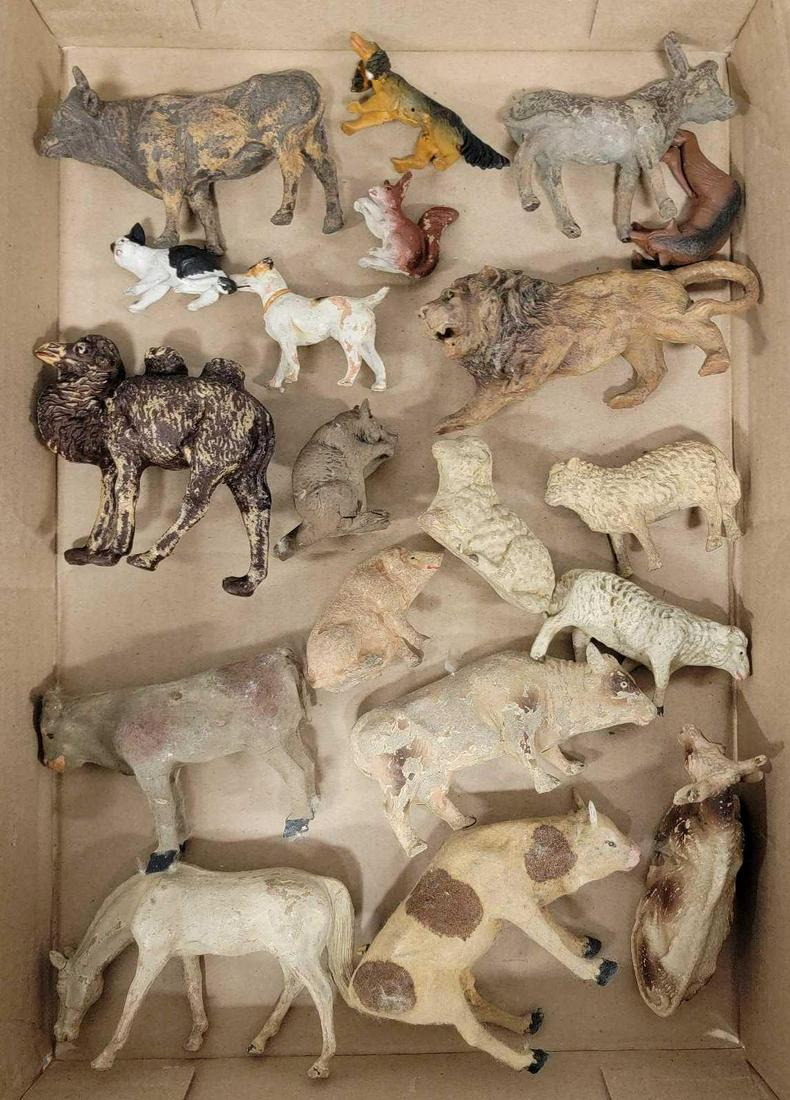 Nineteen Antique German Christmas Putz animals: Nineteen Antique German Christmas Putz animals, the largest of this collection is a cow, he measures 4 1/2 inches long and 3 inches tall and is flocked, these are assorted makers, most unmarked, most 