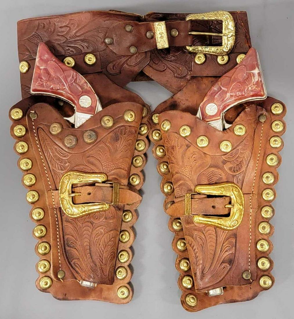 Kilgore Ranger Toy Cap Gun Double Holster Set: Ranger Toy Cap Gun Double Holster Set, cap guns made by Kilgore, guns Measure about 9 inches in length. Both work with clean bodies, grips are good with no cracks. Holster is made by Western Boy, a ma