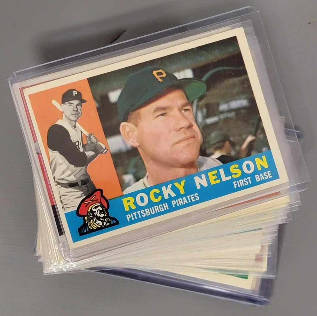 Fifty-seven 1960 Topps common baseball cards: Fifty 1960 Topps common baseball cards, cards fall between #155-#301, there are duplicates, they range from good to excellent, a few may have old tape remnants from mounting, most will have light edge