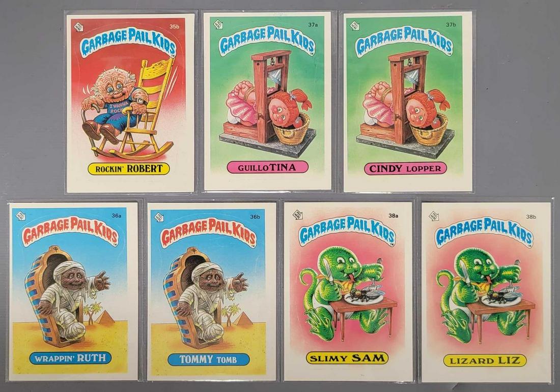 Seven 1985 Topps Series 1 Garbage Pail Kids GPK cards: Seven 1985 Series 1 Garbage Pail Kids GPK cards, includes 35b Rockin Robert, 36a Wrappin Ruth, 36b Tommy Tomb, 37a Guillo Tina, 37b Cindy Lopper, 38a Slimy Sam and 38b Lizard Liz, all are excellent wi