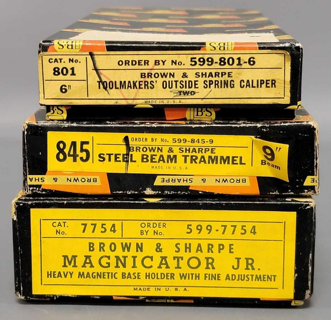 Three different Brown & Sharpe machinist tools new in original boxes: Three different Brown & Sharpe machinist tools new in original boxes, includes 7754 Magnicator Jr, two 801 Toolmakers outside spring calipers and an 845 9 inch Steel Beam Trammel, all are new old