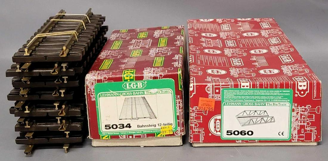Collection of LGB G Gauge train track and accessories: Collection of LGB G Gauge train track and accessories, includes thirteen loose pieces of #1000 straight track pieces, one #5060 Bridge in original box and a box of #5034 platform parts.