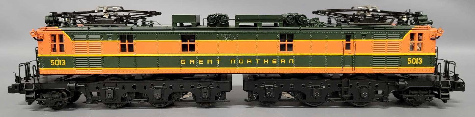 MTH O Gauge Great Northern #5013 Y-1 3-rail Box Cab Electric locomotive in original box: MTH O Gauge Great Northern #5013 Y-1 3-rail Box Cab Electric locomotive in original box, #20-5526 locomotive is excellent C7, looks lightly run if at all, comes in a good box with average wear.