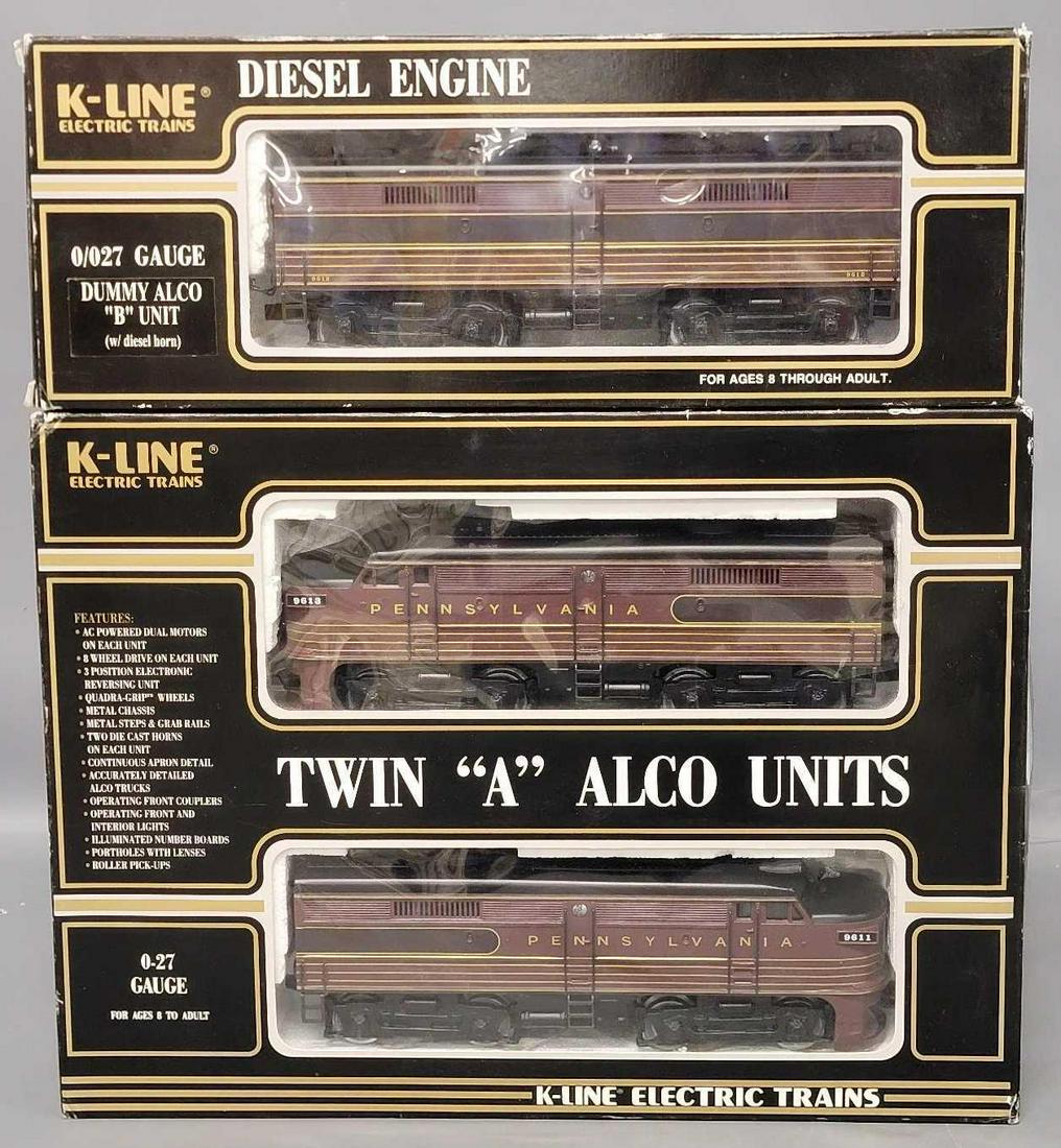 Two K-Line O Gauge Pennsylvania Diesel units in original boxes: Two K-Line O Gauge Pennsylvania Diesel units in original boxes, includes twin powered A Alcos including 9611 Leading and 9613 trailing in one set box and 9612 Dummy Alco B unit, all appear C6-7 with r
