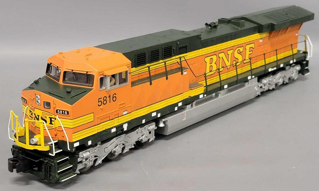 MTH O Gauge BNSF DASH-9 Dummy Diesel Locomotive: MTH O Gauge BNSF DASH-9 Dummy Diesel Locomotive, locomotive appears C6-7, it has a few minor scratches mainly on bottom of the unit, the side railings need adjustments as they have bent in areas.