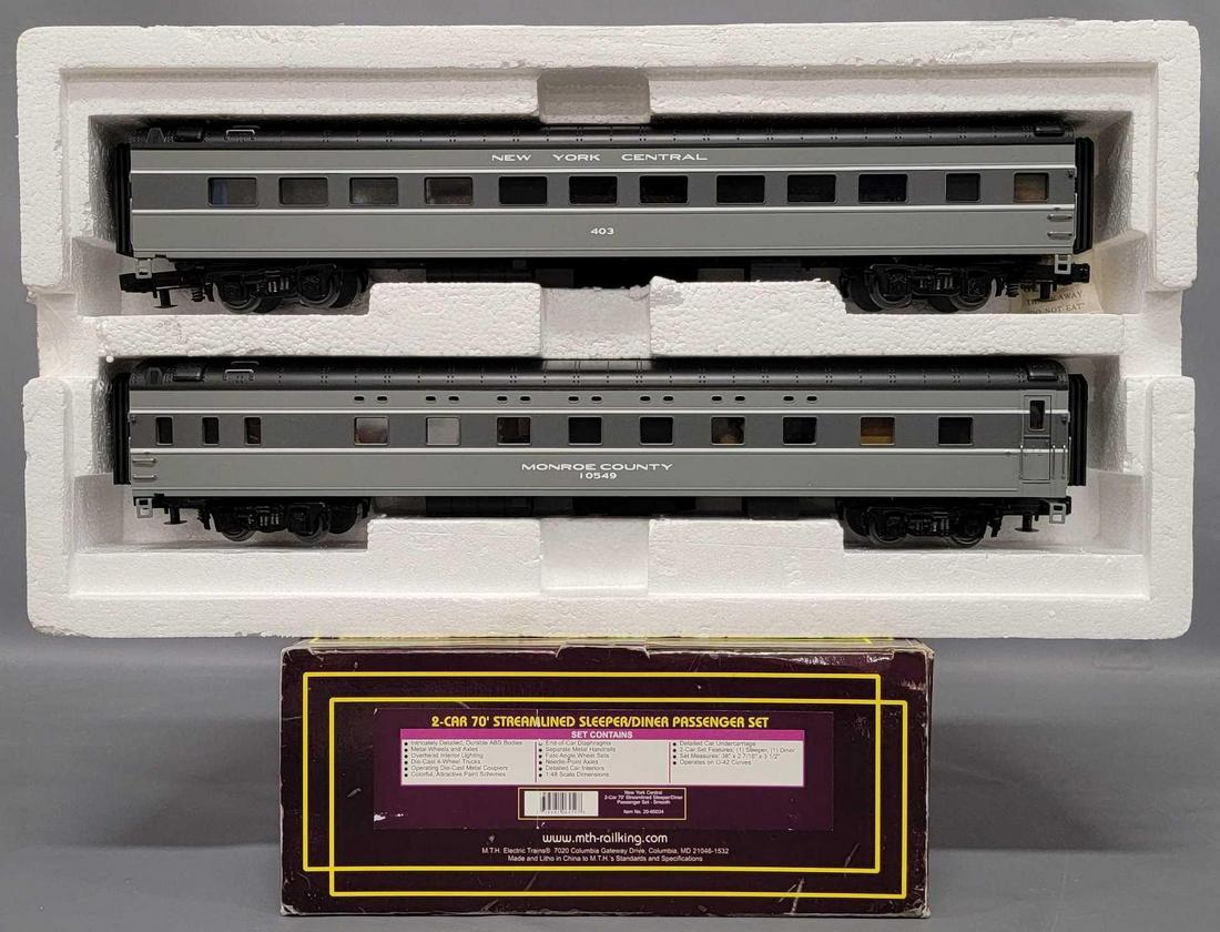 MTH O Gauge New York Central 2-car 70 foot sleeper diner passenger set in original box: MTH O Gauge New York Central 2-car 70 foot sleeper diner passenger set in original box, set is C7 with run time, includes 403 NYC and 10549 Monroe county, these come in a good original box with shelf 