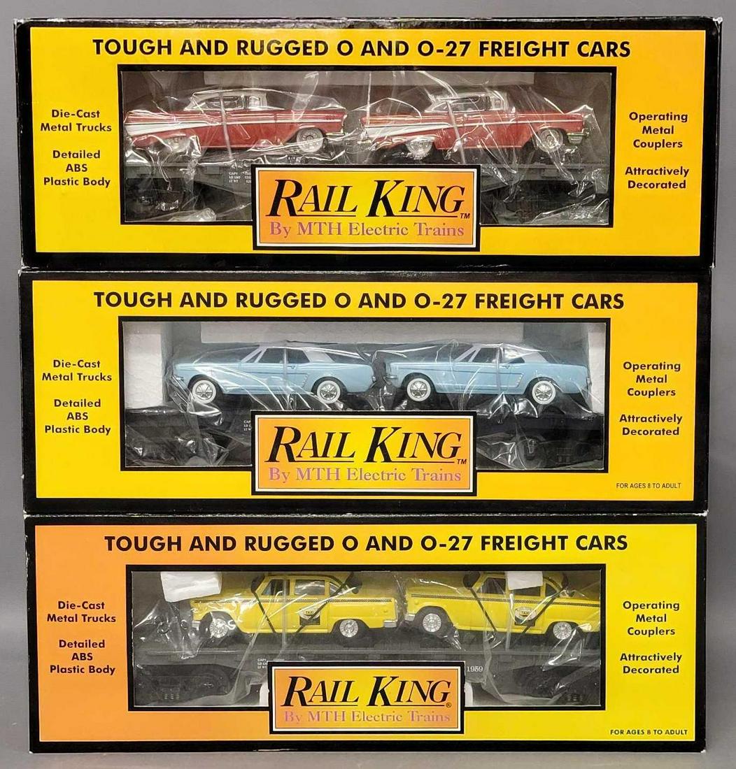 Three Rail King O Gauge MTH Auto transport flat car with ERTL cars in original boxes: Three Rail King O Gauge MTH Auto transport flat car with ERTL cars in original boxes, includes 7625 with 1959 Taxis, 7617 with 1964 Mustangs and 7610 with 1957 Chevys, all appear C7-8 with little to n